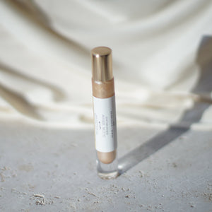 HARLOW Glow Serum with cooling rollerball applicator in weighted glass bottle