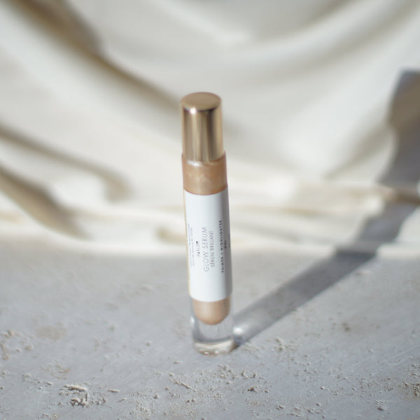 HARLOW Glow Serum with cooling rollerball applicator in weighted glass bottle