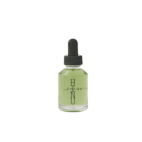 A bottle of HINU Hair Growth Oil — a natural, lightweight oil blend for supporting healthy, conditioned hair from scalp to ends. 30ml