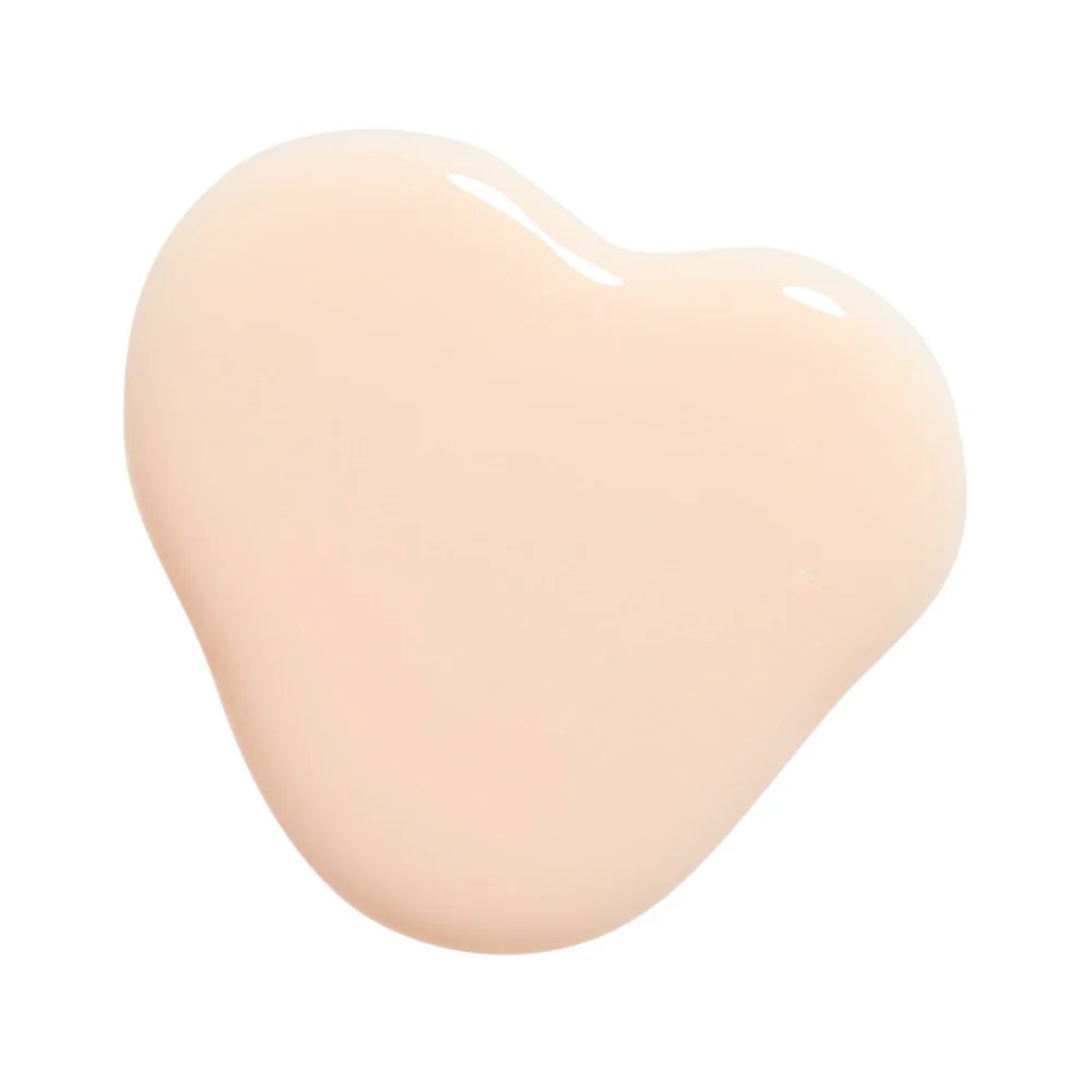 Huella Ballet Blanc nail lacquer in a sheer nude shade, featuring a 15-free, vegan, and chip-resistant formula.