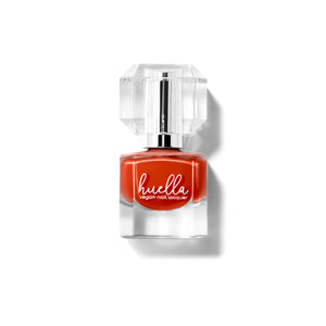 Huella Desert Dream nail lacquer in a warm desert orange shade, featuring a 15-free, vegan, and chip-resistant formula.