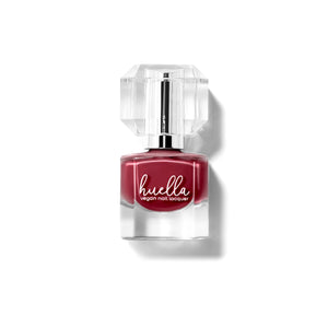 Huella Heartbreaker nail lacquer in a rich burgundy shade with plum undertones, featuring a 15-free, vegan, and chip-resistant formula.