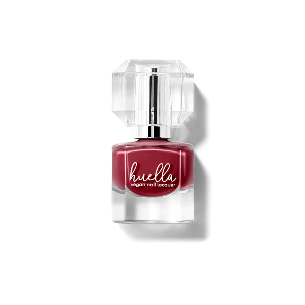 Huella Heartbreaker nail lacquer in a rich burgundy shade with plum undertones, featuring a 15-free, vegan, and chip-resistant formula.