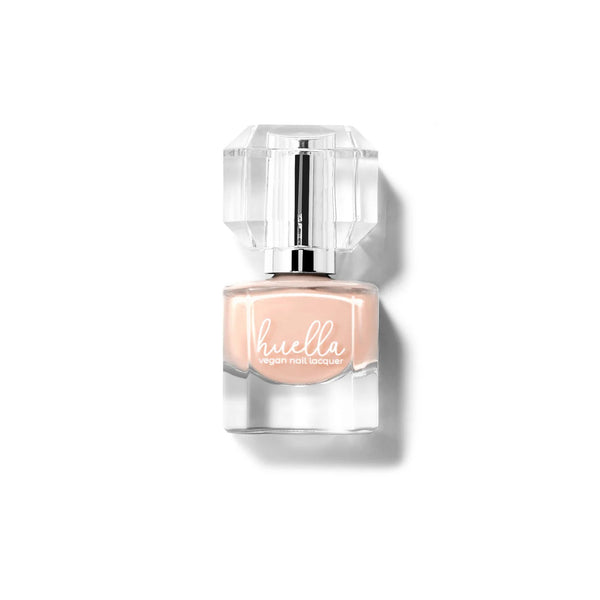 Huella I Do Take You nail lacquer in a sheer nude cream shade, featuring a 15-free, vegan, and chip-resistant formula.