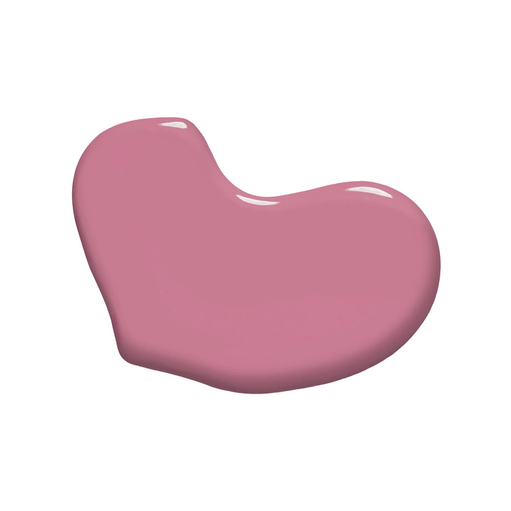 Huella Kiss and Tell nail lacquer in a soft mauve pink shade, featuring a 15-free, vegan, and chip-resistant formula.