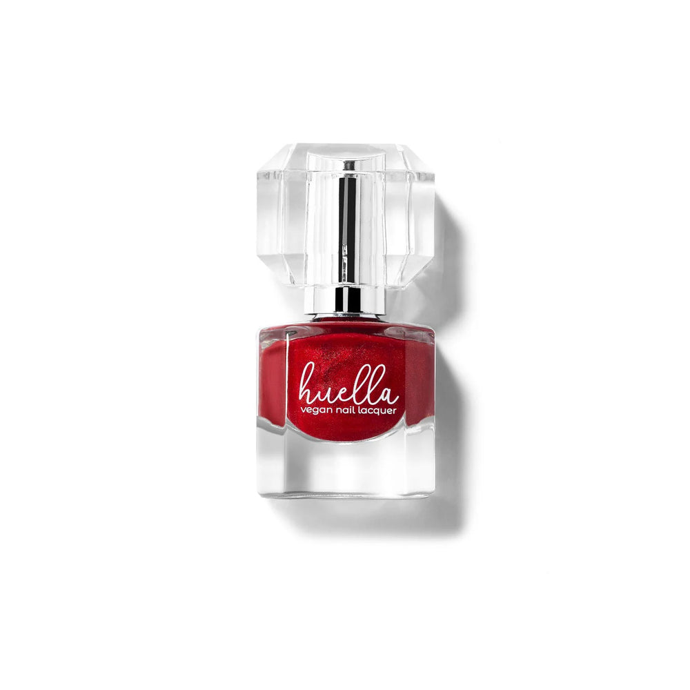 Huella Restore My Soul nail lacquer in a shimmery classic red, featuring a 15-free, vegan, and chip-resistant formula.