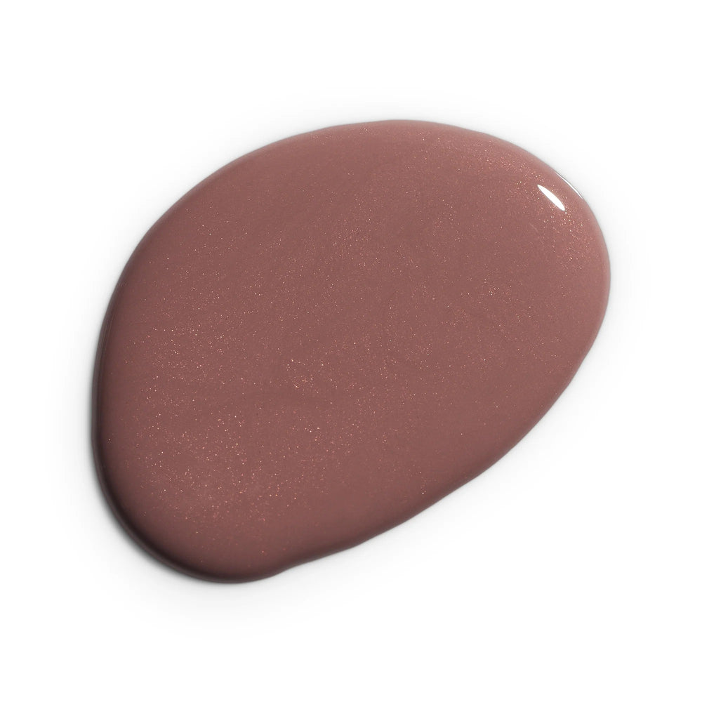 Huella The Berries nail lacquer in a dark mauve shade with slight shimmer, featuring a 15-free, vegan, and chip-resistant formula.