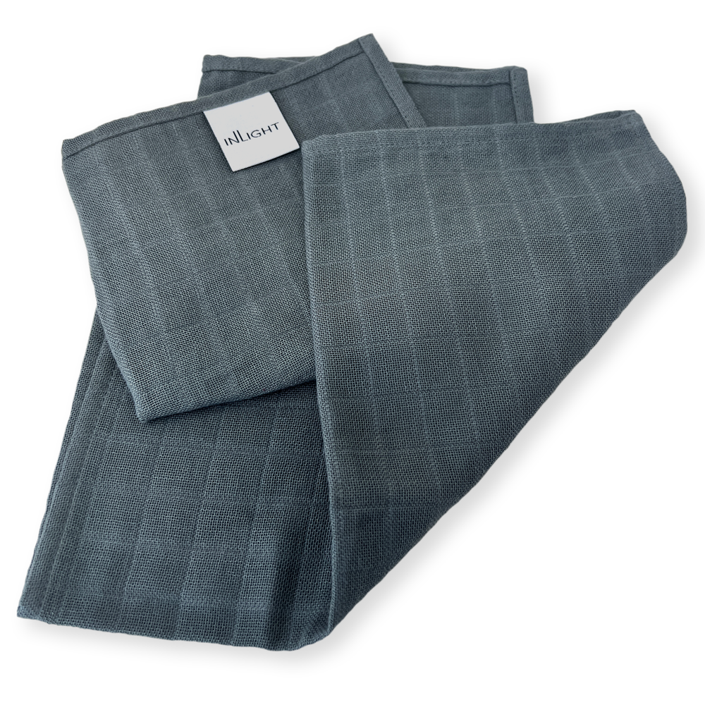 Inlight Beauty Cotton Face Cloths - Set of 2 organic cotton muslin cloths for gentle makeup removal and mild exfoliation. Ideal for use with Inlight skincare products.