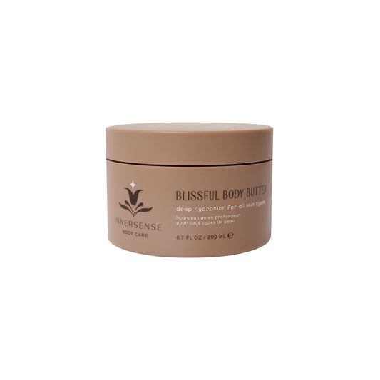 Blissful Body Butter by INNERSENSE Organic Beauty, showcasing a luxurious cream texture with Mango Seed Butter and Vitarevive Trio for deep hydration and a radiant glow.