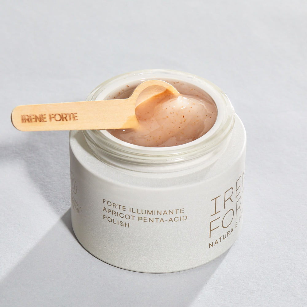 Irene Forte skincare product with packaging on a white background. Irene Forte Skincare Apricot Penta-Acid Polish with apricot seed powder and fruit-derived AHAs.