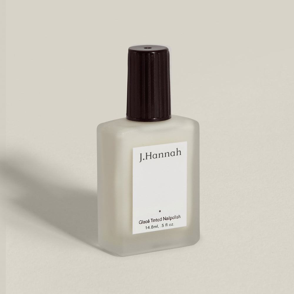 J. Hannah Milk Glacé Tint Nail Polish - Semi-sheer, off-white shade with a creamy, soft finish. Non-toxic and cruelty-free nail polish.
