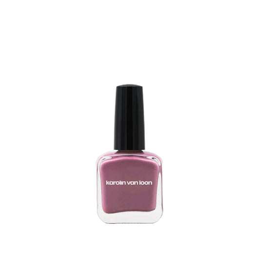 A bottle of Karolin Van Loon nail polish in shade 44 Jus de Prune, featuring a novel violet pink color with a hint of grey, resembling the sweetness of a ripe plum.