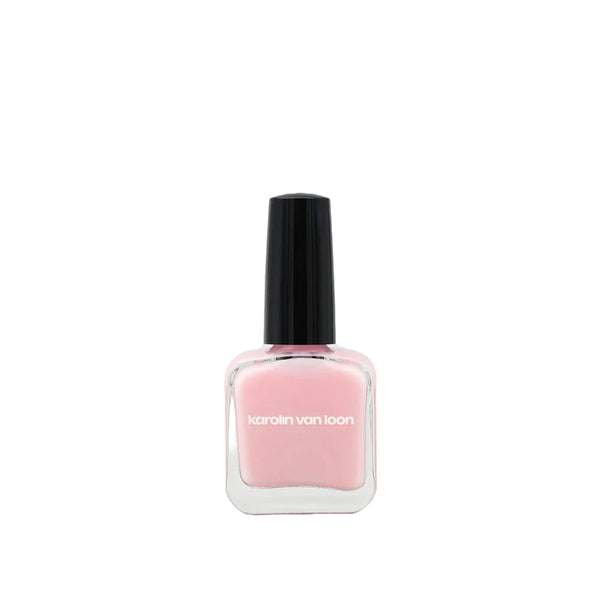 A bottle of Karolin Van Loon nail polish in shade 50 Rosé Doux, featuring a soft mademoiselle pink color perfect for all seasons, offering a delicate ballerina look in winter and a playful cotton candy hue for summer.