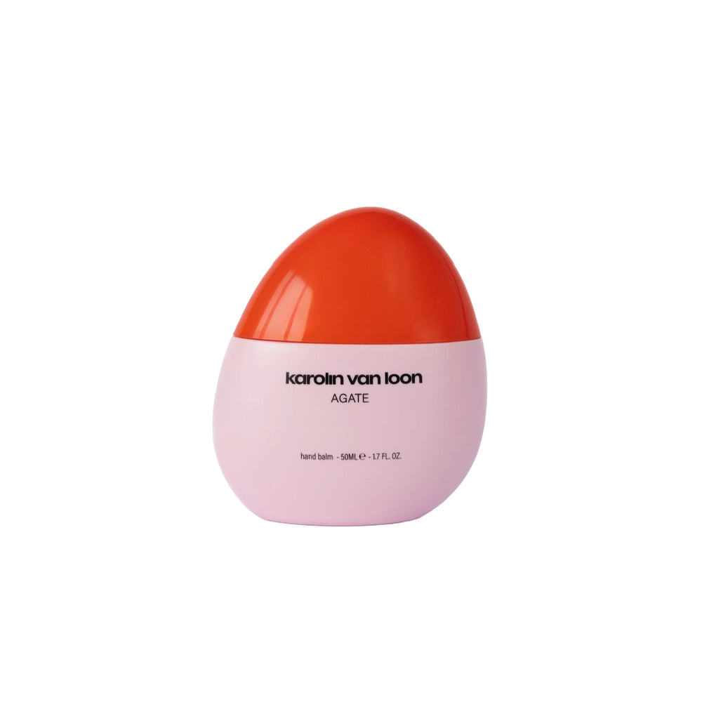 KAROLIN VAN LOON Agate Hand Balm bottle with coral-pink cap, a nourishing vegan hand lotion inspired by agate crystals and scented with fig.