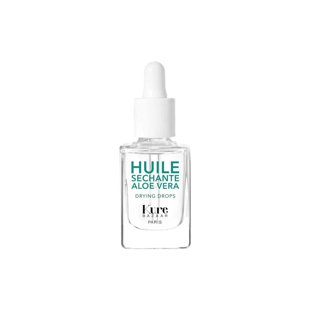 A clear glass dropper bottle of Kure Bazaar Drying Drops with Aloe Vera, featuring a white dropper cap and teal and black text on a white background.