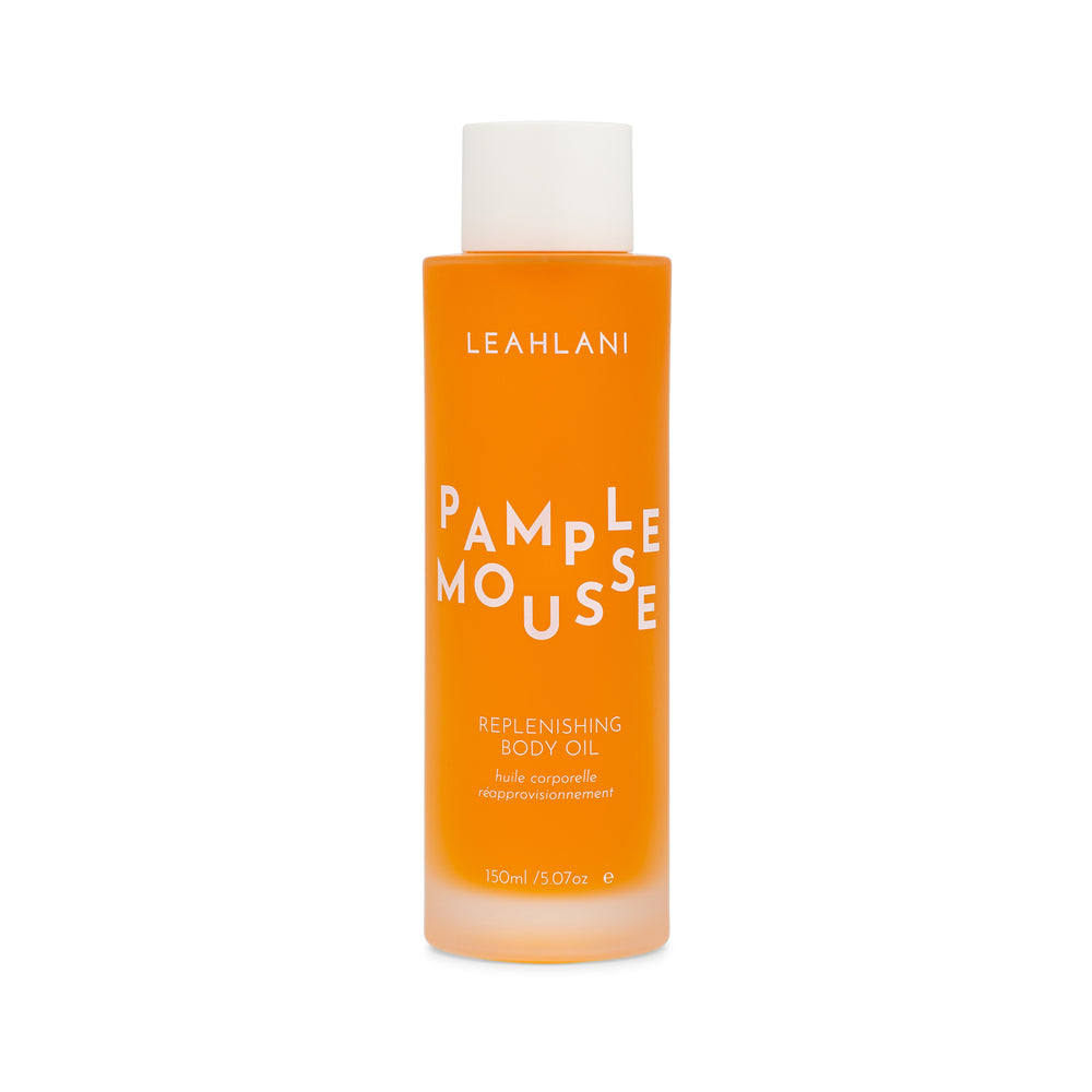 Leahlani Skincare Pamplemousse Replenishing Body Oil – luxurious tropical body oil in a glass bottle, infused with grapefruit, plumeria, vanilla, and antioxidant-rich botanicals.