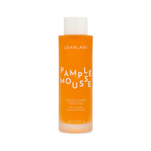 Leahlani Skincare Pamplemousse Replenishing Body Oil – luxurious tropical body oil in a glass bottle, infused with grapefruit, plumeria, vanilla, and antioxidant-rich botanicals.