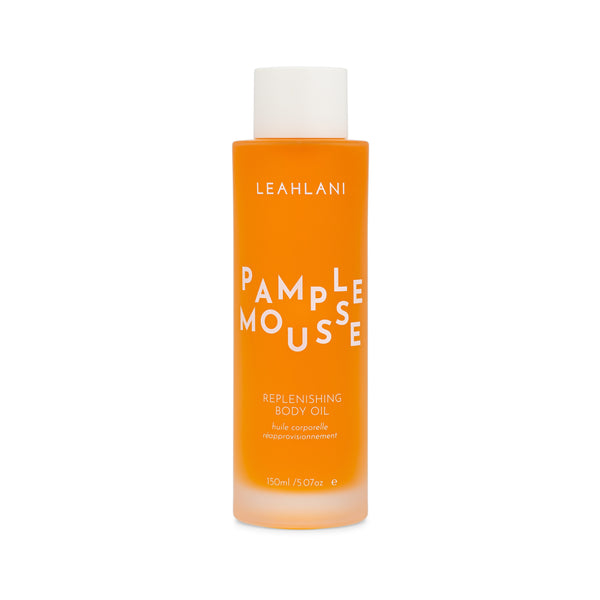 Leahlani Skincare Pamplemousse Replenishing Body Oil – luxurious tropical body oil in a glass bottle, infused with grapefruit, plumeria, vanilla, and antioxidant-rich botanicals.