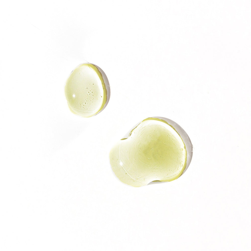 Leahlani Skincare Happy Hour Soothing Serum in a glass pump bottle, featuring calming lavender and blue tansy for sensitive, stressed-looking skin.