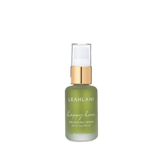 Leahlani Skincare Happy Hour Soothing Serum in a glass pump bottle, featuring calming lavender and blue tansy for sensitive, stressed-looking skin.