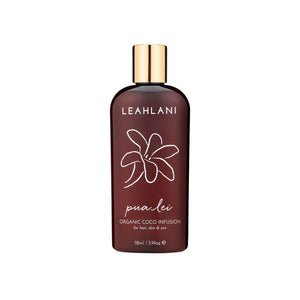 Leahlani Skincare Pua Lei Coco Infusion body oil in a bottle, a lightweight coconut and kukui oil blend with tropical florals for silky, nourished skin and lustrous hair.