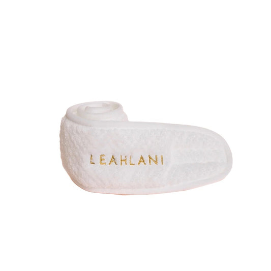 Soft cotton headband with velcro closure, ideal for keeping hair dry during skincare routines or makeup application, adding spa-like luxury to home beauty rituals.