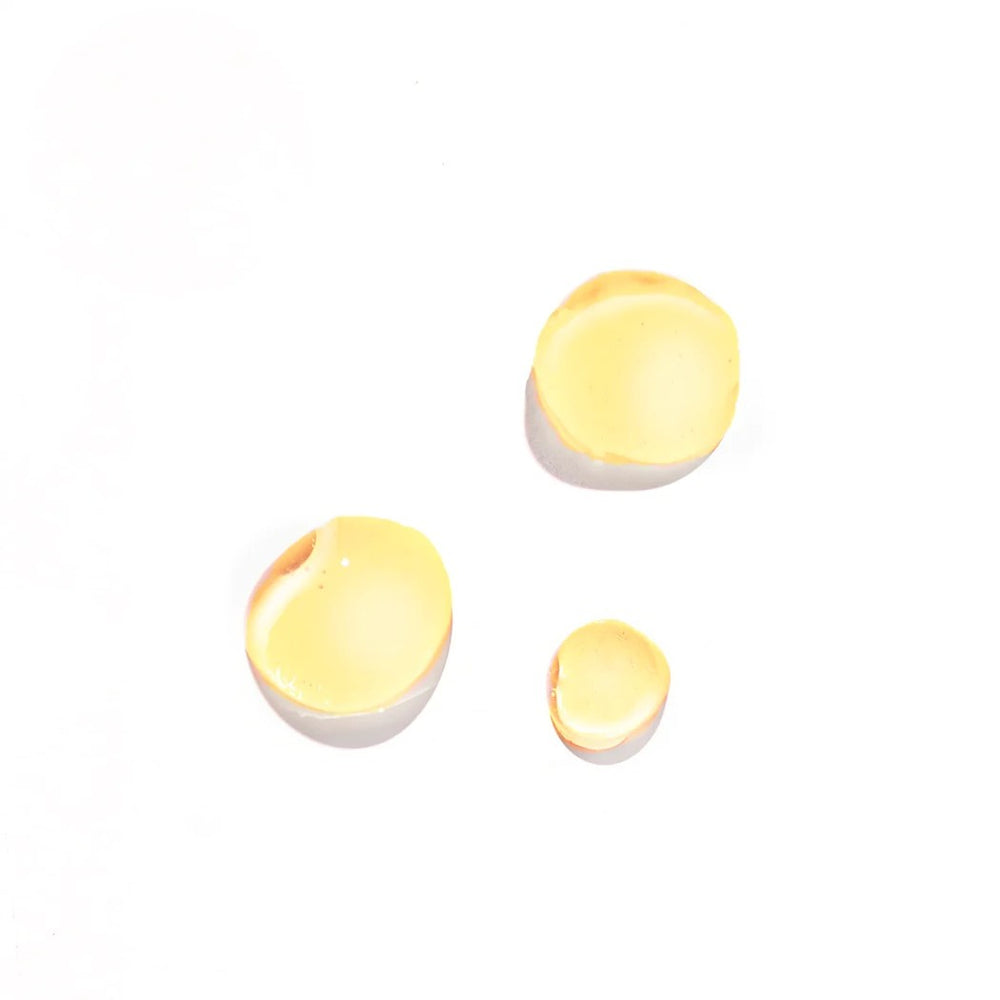 Leahlani Skincare Siren Brightening Serum in a glass dropper bottle, featuring natural brightening ingredients like sea buckthorn and micro-algae for radiant, even-toned skin.