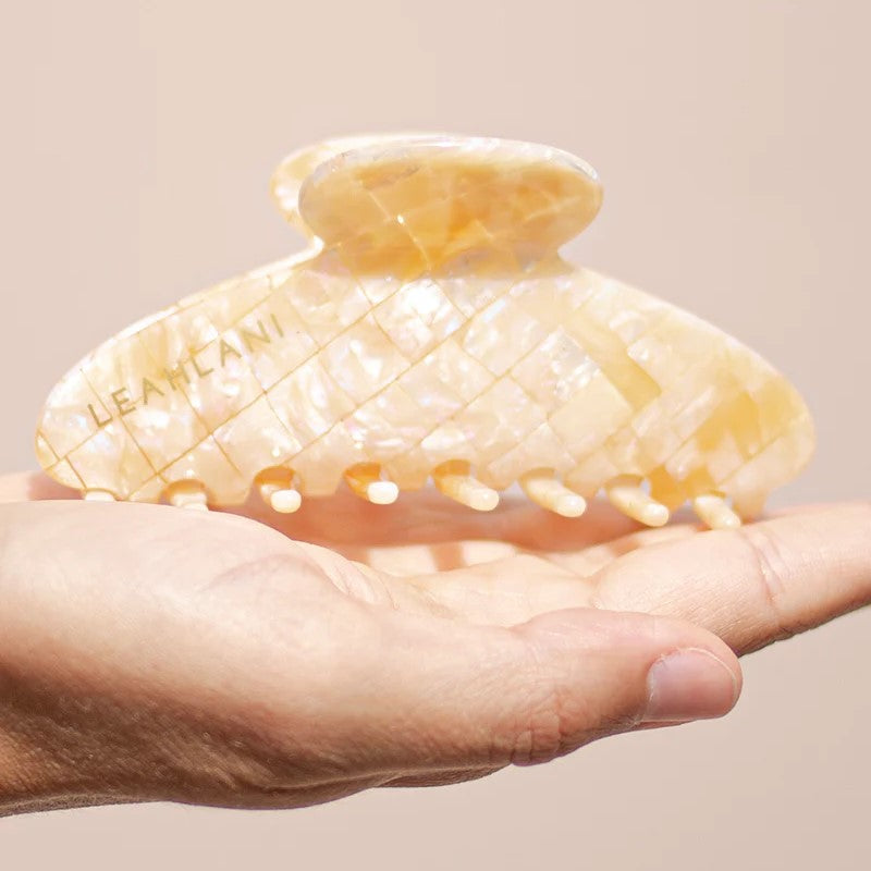 Leahlani Skincare The Pearlescent Clip in a sophisticated Mother-of-Pearl design, made from cellulose acetate, measuring 4.25 inches.