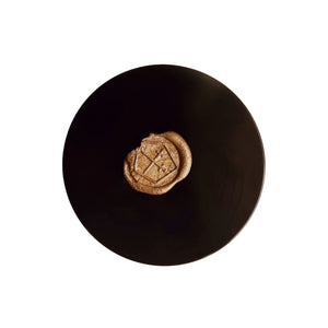 Jar of Lepaar Mandarin Mecca Coffee Scrub, a natural exfoliant with coffee grounds, coconut sugar, and botanicals, designed for gentle body and face exfoliation.