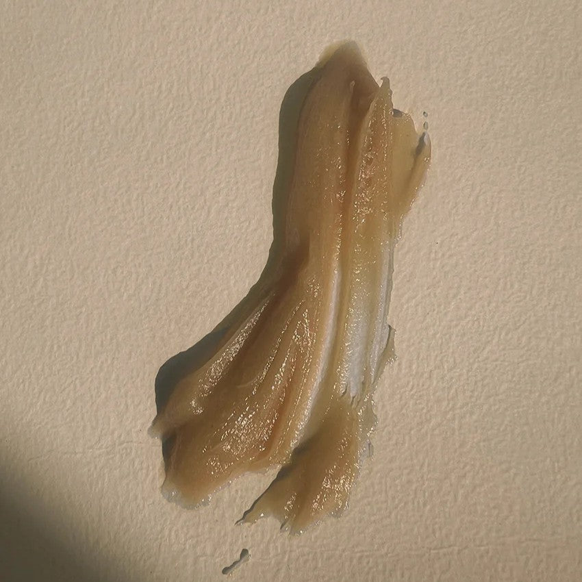 A swatch of LEPAAR Night Milk Honey Mask / Mineralising Natural Aha Face Infusion on beige background