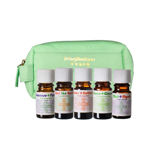 LIVING LIBATIONS Aromatherapy Apothecary Travel Kit - 28 essential oils in 5ml bottles, wrapped in a vibrant, hand-sewn travel pouch. Includes Mint + Myrrh Tooth Serum, Frankincense First Friend Mending Elixir, Illume Hotberry Fortifying Elixir, Illume Classic Camphorous Elixir, and Zest the Best Culinary Chrism. Portable, potent plant elixirs for health and resilience.