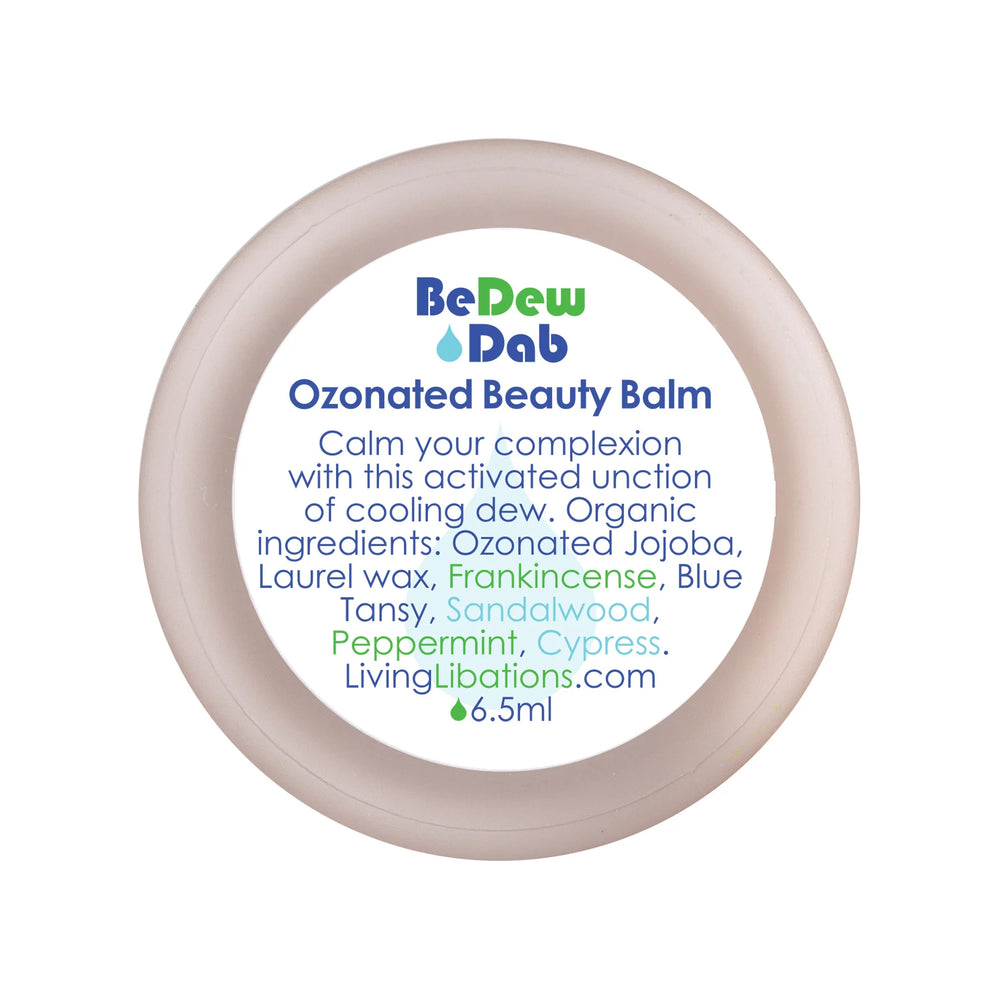 LIVING LIBATIONS BeDew Dab Ozonated Beauty Balm - cooling and soothing balm with O3 activation. Azure-blue botanical oils and fresh ozone calm redness and roughness. Transforms into a silky-soft gel at room temperature. Enriched with frankincense, sandalwood, and cypress for a dewy glow. Ideal for all skin types.