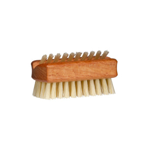Small travel-size beechwood nail brush with double-sided bristles.