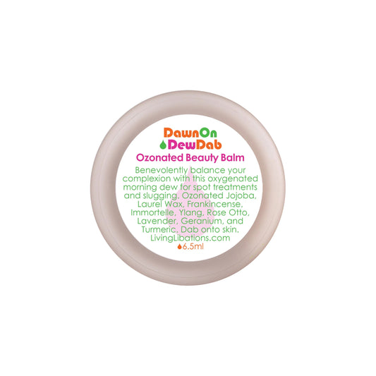 Living Libations Dawn On Dew Dab Ozonated Beauty Balm in a small glass jar, showcasing a silky texture for hydrating and nourishing skin.