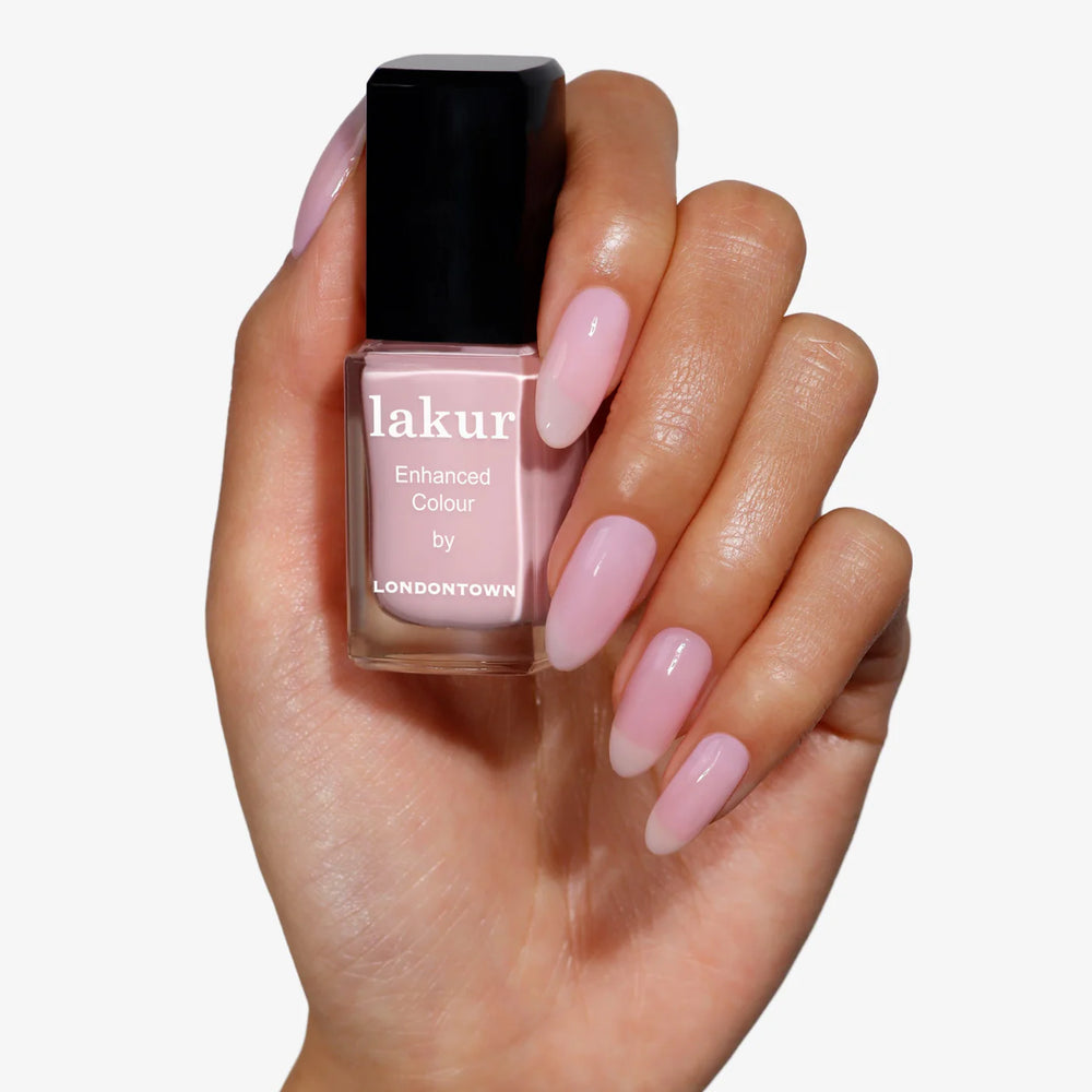 Londontown Magnolia Haze nail polish in a sheer petal pink shade.