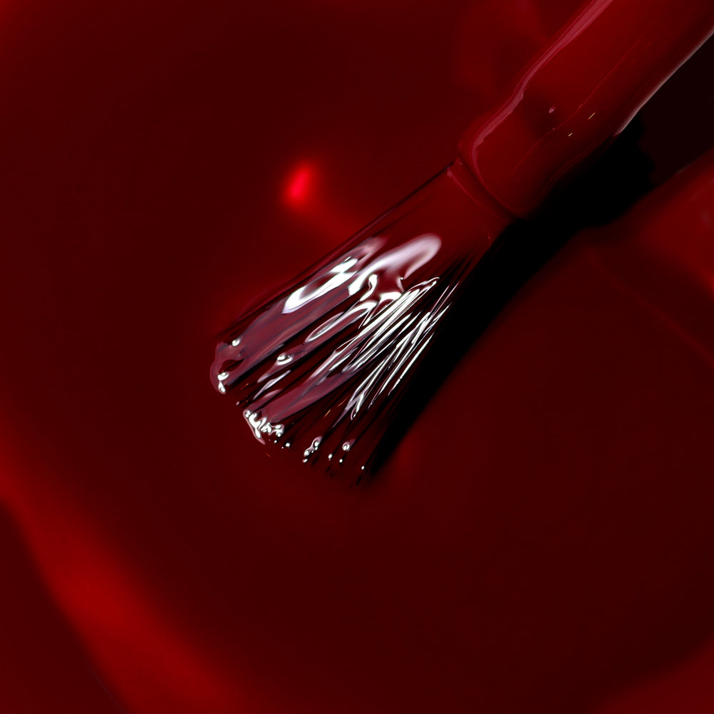 LONDONTOWN Naughty List, a dark red nail polish on white background