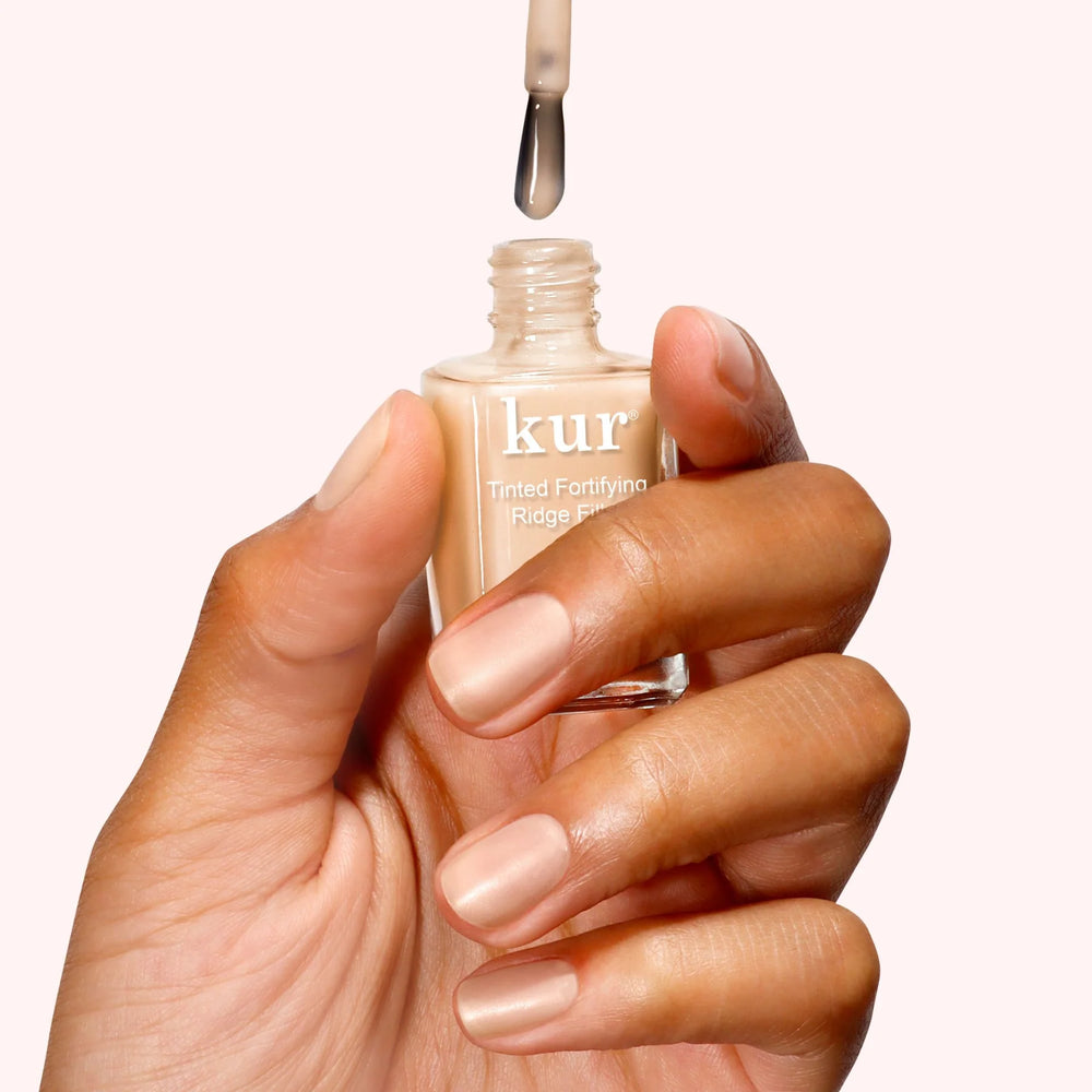 Londontown Tinted Fortifying Ridge Filler in Apricot Beige nail primer bottle with soft satin tint