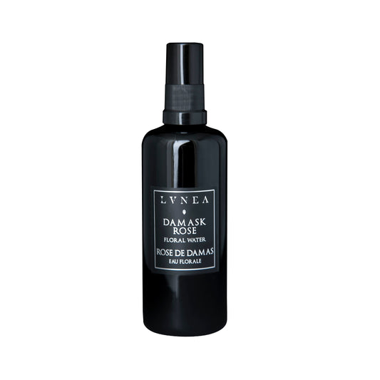 LVNEA Damask Rose Hydrosol – a refreshing, floral botanical mist for hydrating and balancing skin, presented in a 100ml black amethyst glass bottle.