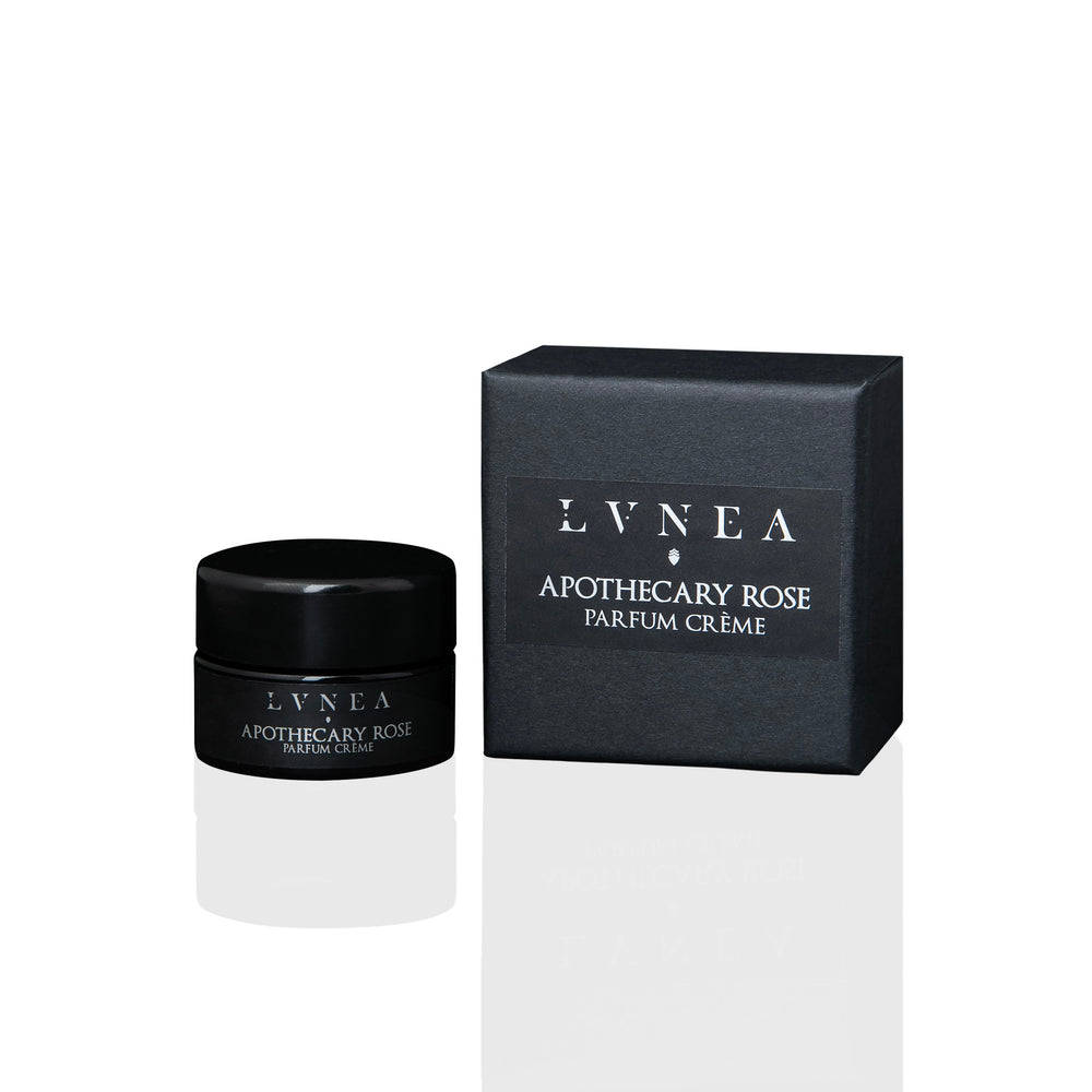 LVNEA Apothecary Rose Parfum Crème in an amethyst glass pot, showcasing a creamy blend of rose gallica, apricot, myrrh, and tarragon, nestled in a gift box.