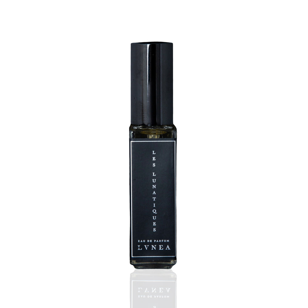 LVNEA Les Lunatiques Eau de Parfum in a 30ml black glass bottle. The fragrance features notes of wormwood, copal, musk, and sandalwood, capturing a lunar-inspired blend of creamy, metallic, and resinous elements. 30ml