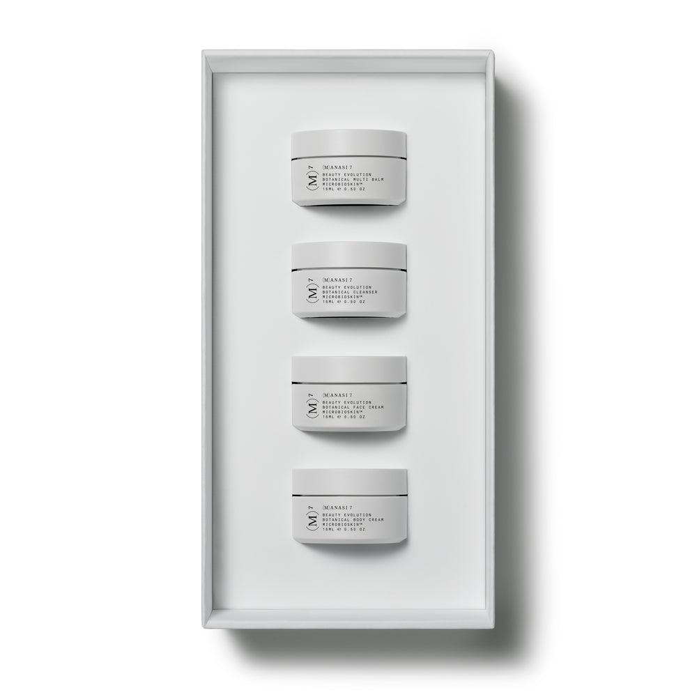 Manasi 7 Limited Edition Discovery Set featuring four travel-size skincare jars from the Microbioskin™ collection in a sleek presentation box.