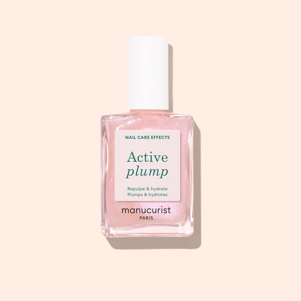 Bottle of MANUCURIST Active Plump baby pink polish with a pearly, semi-opaque finish.