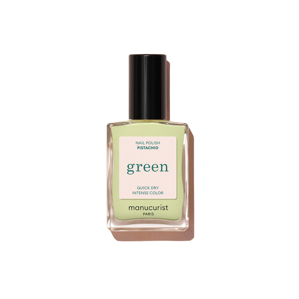 Manucurist Green™ Pistachio—a pale green nail polish with subtle yellow undertones in a 15ml bottle.