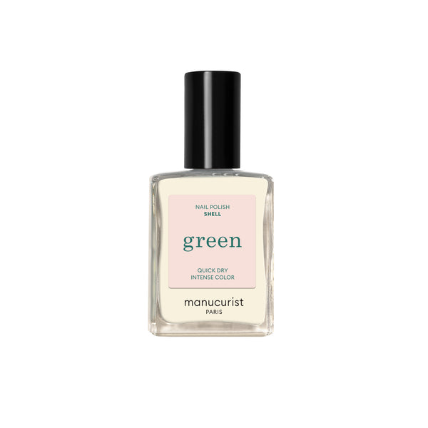 A bottle of Manucurist nail polish in the shade Shell on white background.