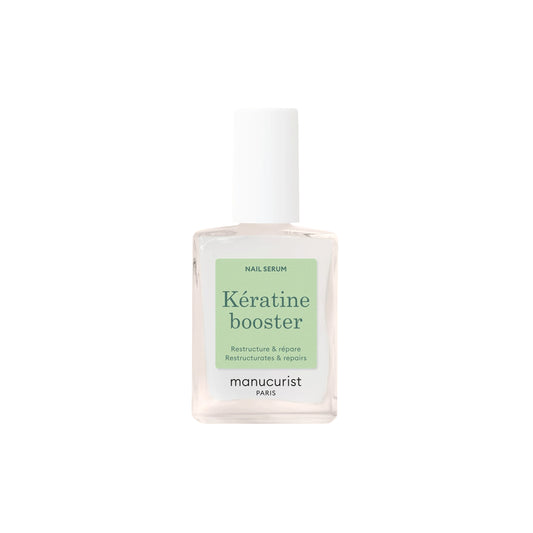 Close-up of MANUCURIST Kératine Booster Nail Strengthening Serum bottle, a keratin-rich polish designed to harden, repair, and fortify soft nails.