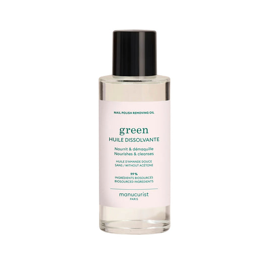 Bottle of Manucurist Green™ Nail Polish Removing Oil with orange blossom scent, enriched with sweet almond oil for gentle and nourishing nail polish removal.