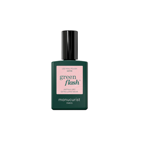Bottle of MANUCURIST Green Flash™ Satin semi-permanent nail polish in a pale pearly pink shade with a soft, luminous finish.