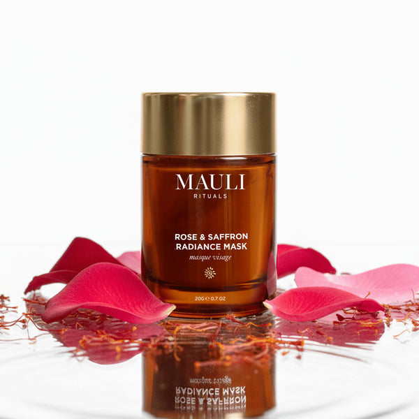 MAULI Rituals Rose & Saffron Radiance Mask jar with pink petals on a white background