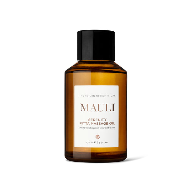 Glass amber bottle of Mauli Rituals Serenity Pitta Massage Oil on a white background