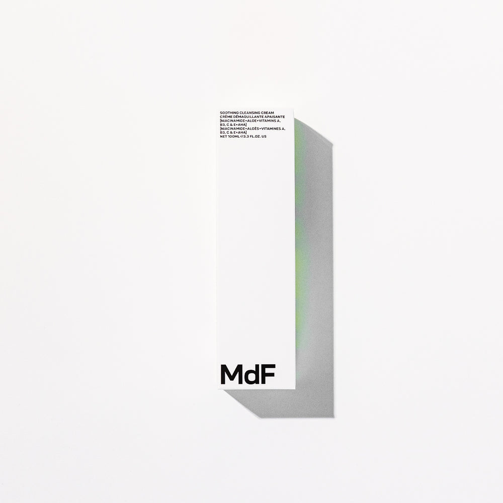 Silver tube of MDF soothing cleansing cream on a white background